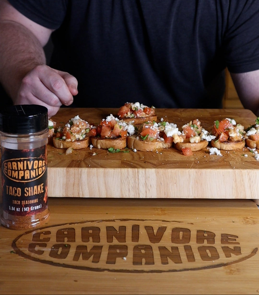 Pico De Gallo Bruschetta appetizer on wooden cutting board using Taco Shake Meat Seasoning from Carnivore Companion